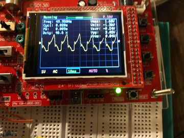 Oscilloscope showing the induced current with peaks at 50Hz